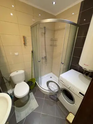 a bathroom with a shower and a toilet and a sink at Sea Diamond 2 in Sunny Beach