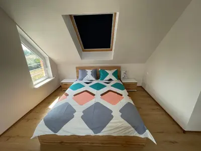 a bedroom with a bed with a tv on the wall at Sea Diamond 2 in Sunny Beach