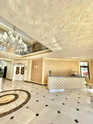 a large room with a lobby with a chandelier at Millennium 2 - Private apartment - BSR in Sveti Vlas