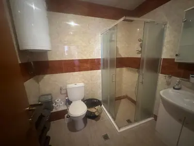 a bathroom with a toilet and a shower and a sink at Amartmán přímo u moře - Elenite až 5 osob in Sveti Vlas