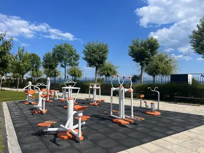 a group of exercise equipment in a park at PREMIER HOUSE BEACH Hotel in Sveti Vlas