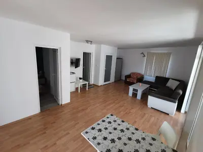 a living room with a couch and a table at Emona 5 floor 4 in Burgas City