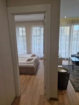 a bedroom with a bed in a room with windows at NEU 2025 Emila Romana Boutique- Modernes Luxury Living in Sunny Beach