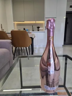 a bottle sitting on top of a glass table at NEU 2025 Emila Romana Boutique- Modernes Luxury Living in Sunny Beach
