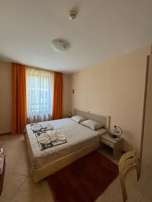 a bedroom with a large bed and a window at VP Royal Sun in Sunny Beach