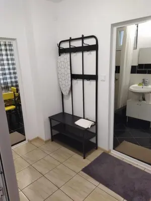 a bathroom with a black shelf next to a sink at Emona 5 floor 3 in Burgas City