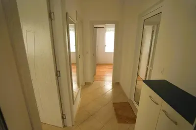 an empty room with a hallway with two doors at Emona 5 floor 2 in Burgas City