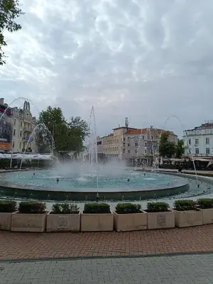 a large fountain in the middle of a city at Апартамента на центъра на Варна до фонтаните и морето и градинта in Varna City