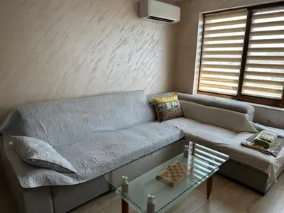 a living room with a couch and a glass table at Apartment Tuthon in Pomorie