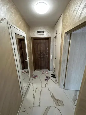 a room with a hallway with a door and a tile floor at Apartment Tuthon in Pomorie