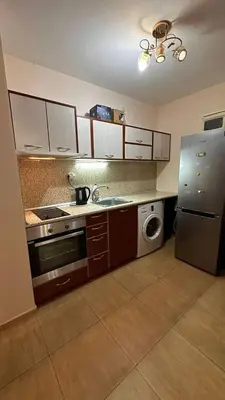 a kitchen with a refrigerator and a washing machine at Sveti Vlas, Paradise Dreams Apartment in Sveti Vlas