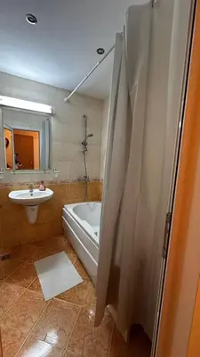 a bathroom with a bath tub and a sink at Sveti Vlas, Paradise Dreams Apartment in Sveti Vlas