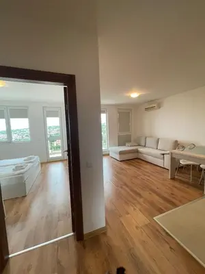 a living room with a couch and a table at Fortuna Cape 4 apartment in Byala