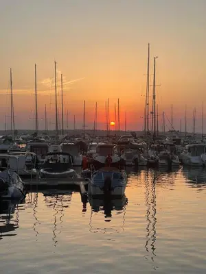 a group of boats docked in a marina at sunset at Amara Holiday Santa Marina, Sozopol in Sozopol