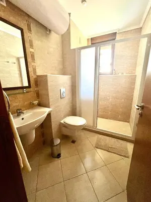 a bathroom with a toilet and a sink and a shower at Amara Holiday Santa Marina, Sozopol in Sozopol