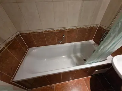 a white bath tub in a bathroom with a sink at Apartament Hotel Miramar Palace in Sunny Beach
