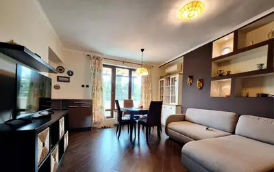 a living room with a couch and a table at Veneto Apartment in Varna City