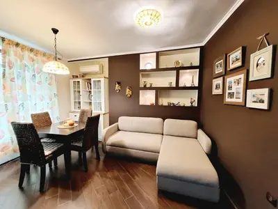 a living room with a couch and a table at Veneto Apartment in Varna City