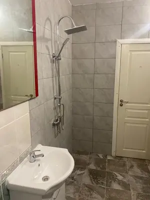 a bathroom with a sink and a shower at Apartments complex Breeze Sunny beach - Апартаменти комплекс Бриз Слънчев бряг in Bŭnzareto