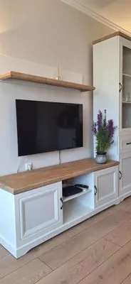 a large white entertainment center with a flat screen tv at Royal Dreams Apartments, Sunny Beach in Sunny Beach
