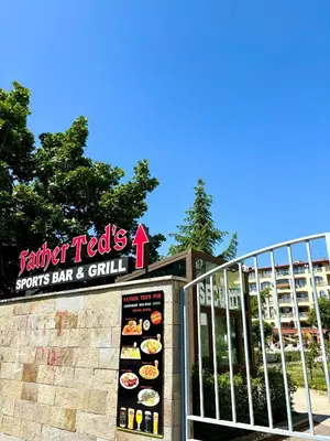 a sign in front of a fast food restaurant at Royal Dreams Apartments, Sunny Beach in Sunny Beach