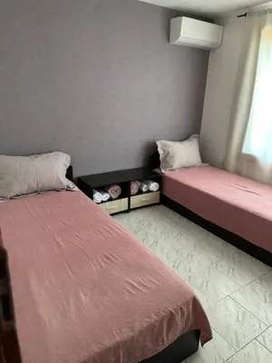 a room with two beds and a window at Villa Nikoleta in Sveti Vlas