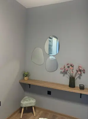 a room with a shelf with mirrors on the wall at La Terrassa 7 in Burgas City
