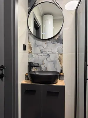 a bathroom with a black sink and a mirror at La Terrassa 7 in Burgas City