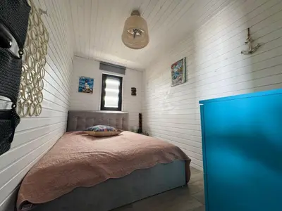a bedroom with a bed in the corner of a room at Camping Gardenia - Bungalow SeaBed in Lozenets