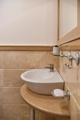 a white sink on a counter in a bathroom at Kaleya House in Chernomorets