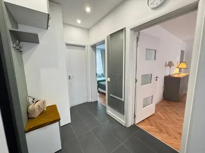 a hallway with a door leading to a room at Apartament A 2BD in Burgas City