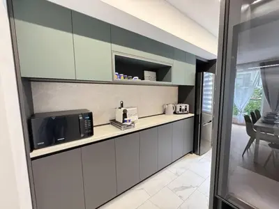 a kitchen with a counter top with a microwave at Apartament A 2BD in Burgas City