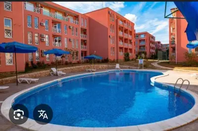 a large swimming pool in front of some buildings at Sunny Day 6 in Sunny Beach