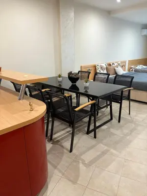 a room with a table and chairs and a bed at Miramar Palace 615 in Sunny Beach