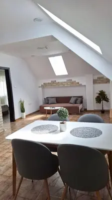 a living room with a table and chairs at Апартамент ReLax Китен in Kiten