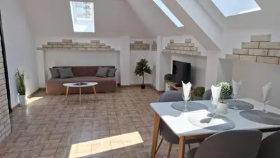 a living room with a couch and a table at Апартамент ReLax Китен in Kiten