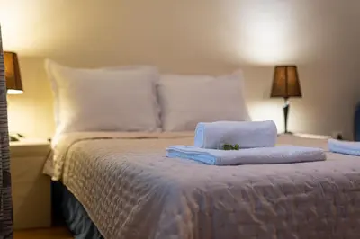 a bedroom with a bed with towels on it at Top Location 3 Bedroom Apartment Next to the Beach in Varna City