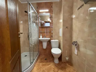 a bathroom with a toilet and a sink and a shower at BW - Happy 67 in Sunny Beach