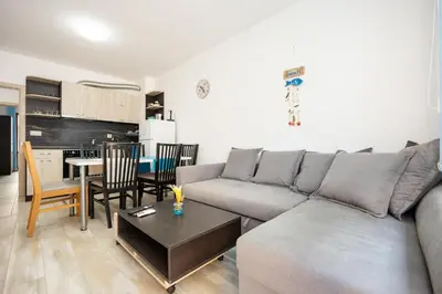 a living room with a couch and a table at Marea 1 in Pomorie