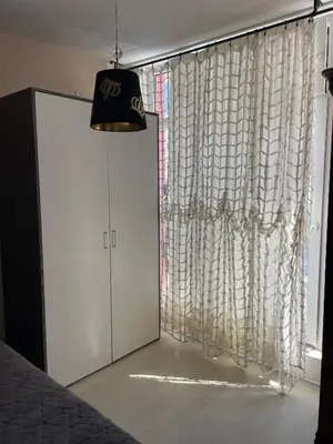 a room with a window with a curtain at Rose Garden Apartment 10 in Sunny Beach