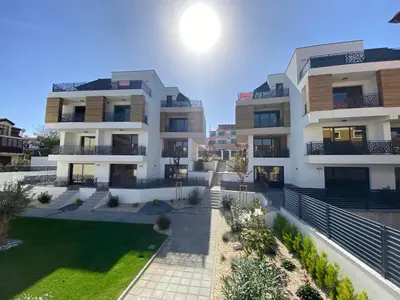 an apartment building with a lawn in front of it at SEA SHELL Apartment in Sozopol