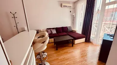a small living room with a couch and a table at SUNNY DAY 6, Apartment 35 in Sunny Beach