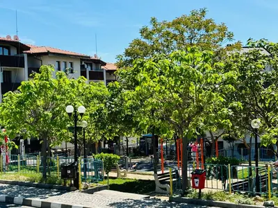 a park with trees and a playground at VODENICATA 5B4 Apartment Sveti Vlas in Sveti Vlas