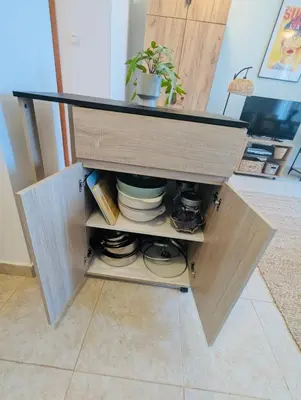 a wooden cabinet with a plant in it at VODENICATA 5B4 Apartment Sveti Vlas in Sveti Vlas