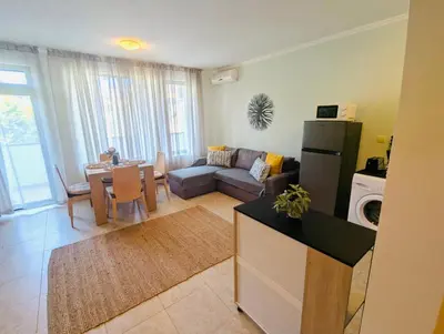 a living room with a couch and a table at VODENICATA 5B4 Apartment Sveti Vlas in Sveti Vlas