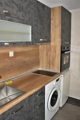 a kitchen with a washing machine and a sink at Иглика Апарт Несебър in Nesebar