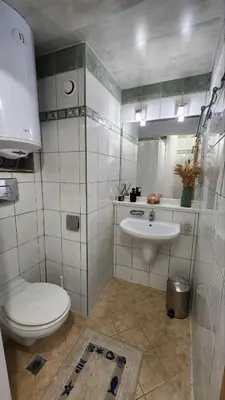 a bathroom with a toilet and a sink at Hotel Solemar in Sunny Beach