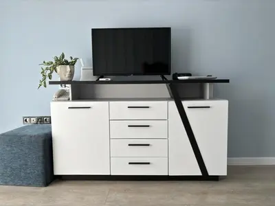 a white entertainment center with a tv on top of it at BW - Studio Grenada 316B in Sunny Beach