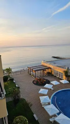 an aerial view of a resort with a swimming pool and the ocean at Boho Breeze Aheloy in Aheloy