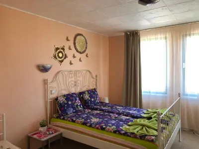 a childs bedroom with a crib in a room at Apartment Terrace under the stars in Primorsko
